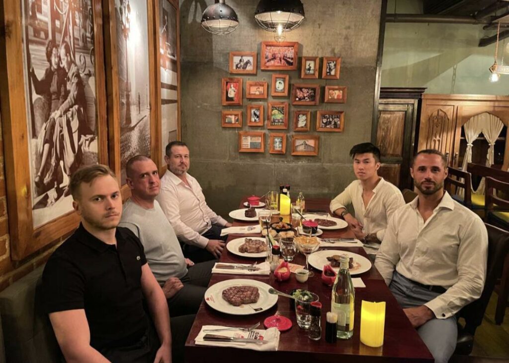 Members of the War Room by Andrew Tate having steaks for dinner in Bangkok.